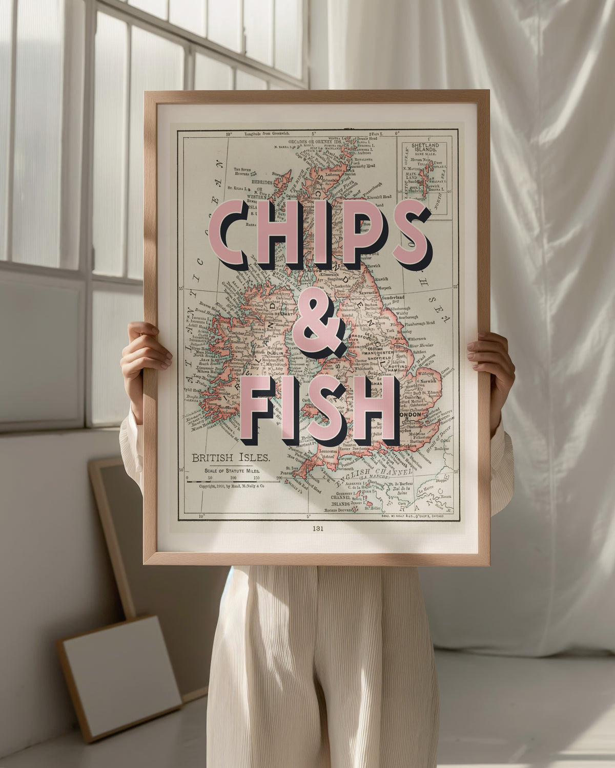 "Stylish wall art featuring a humorous take on a classic British dish, printed on a 1900's map of The British Isles."